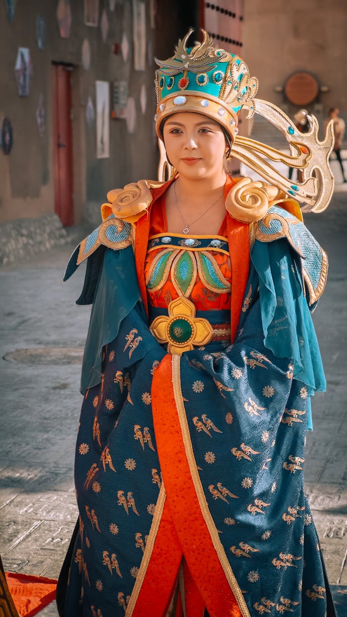 A woman in an elaborate traditional Chinese costume outdoors.